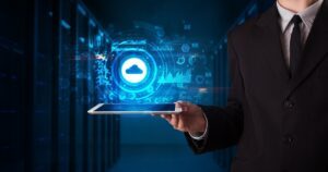 Hand holding tablet with cloud technology and dark concept